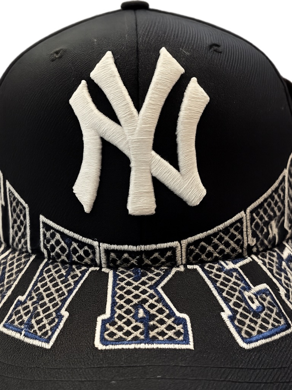 New York Yankees Black Snap Back Baseball Cap with White Embroidered Logo